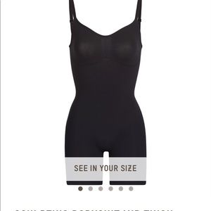 Skims black sculpting body suit mid thigh!